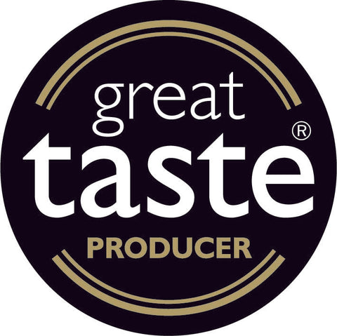 A circular black and gold badge with the words great taste PRODUCER in white and gold text.