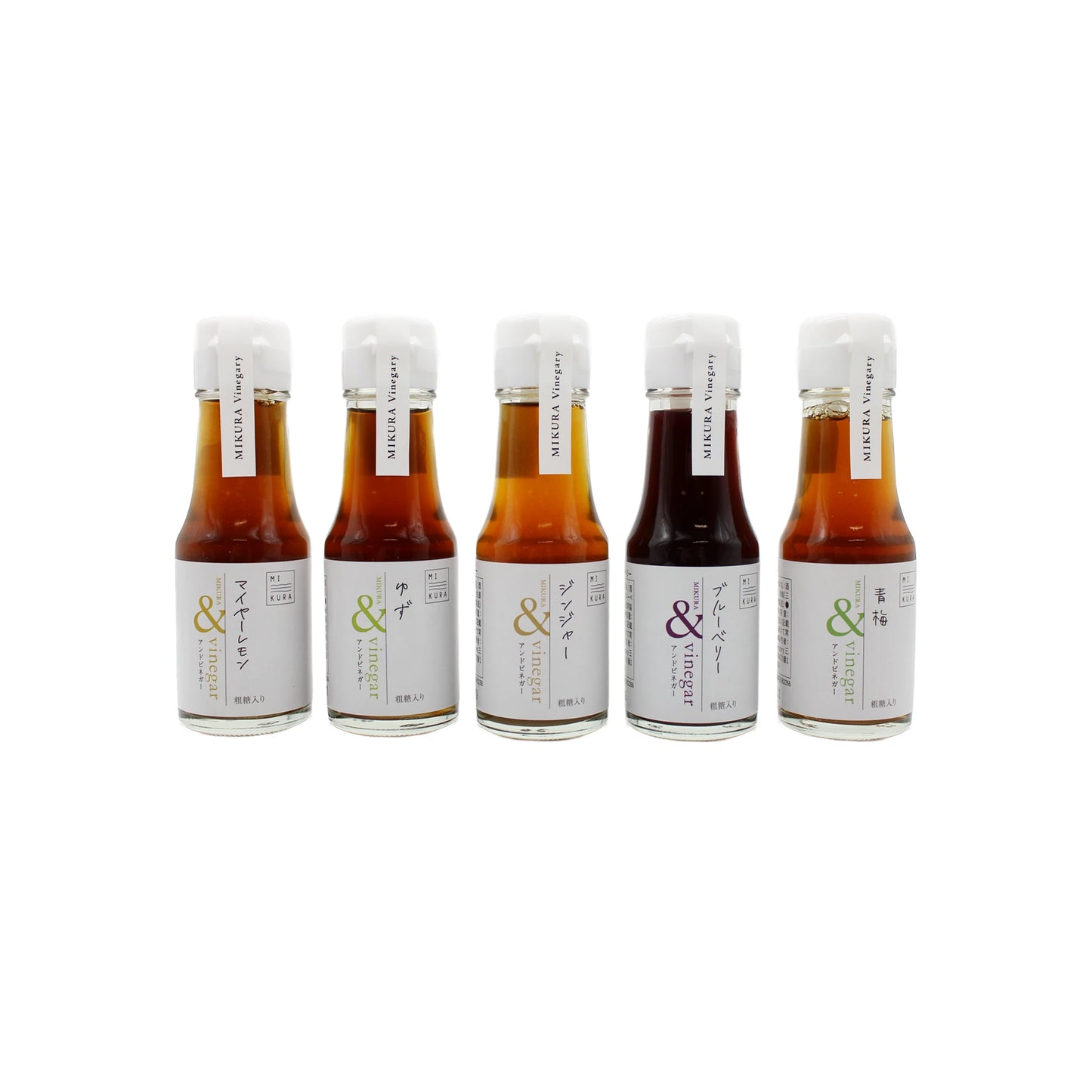 A set of five glass bottles, each labeled in Japanese and topped with white caps, showcases the Set of 5 Vinegars with Fruit & Raw Sugar, including yuzu vinegar from Mikura master vinegary, arranged in a row on a white background.