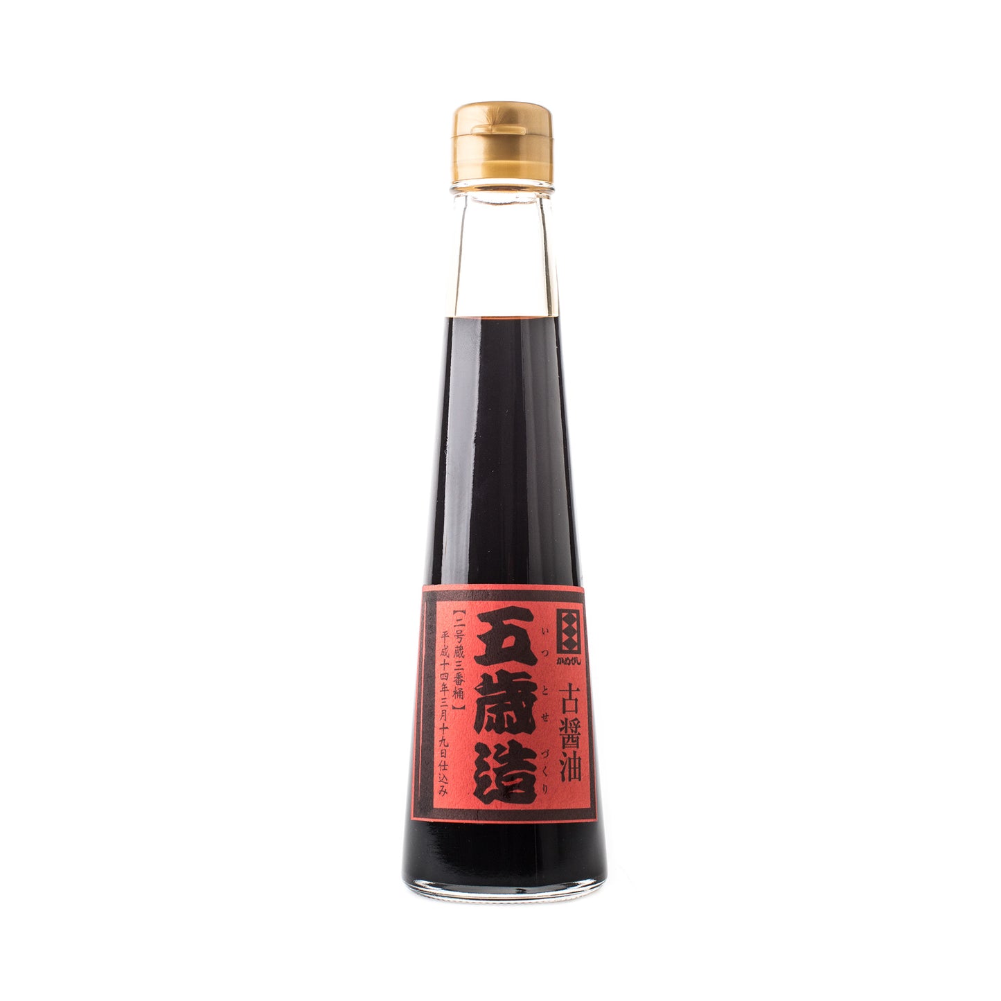 A glass bottle of 5 Year Aged Soy Sauce features a gold cap and a red label with black and white text, emphasizing its unique fermentation process, displayed against a white background.