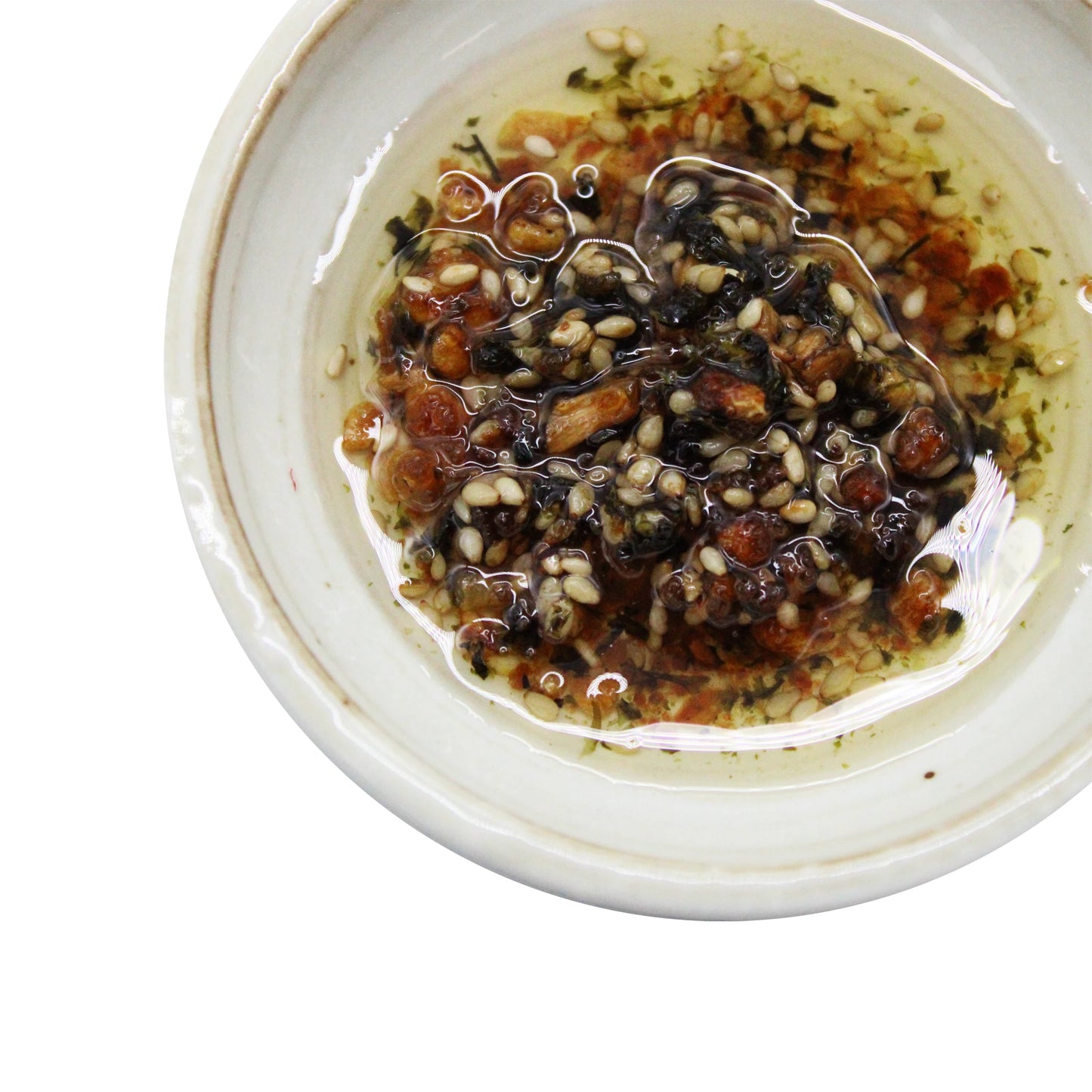 A white bowl filled with chili oil, visible sesame seeds, herbs, and chili flakes, topped with Aosa Seaweed Crispy Condiment - 90g.