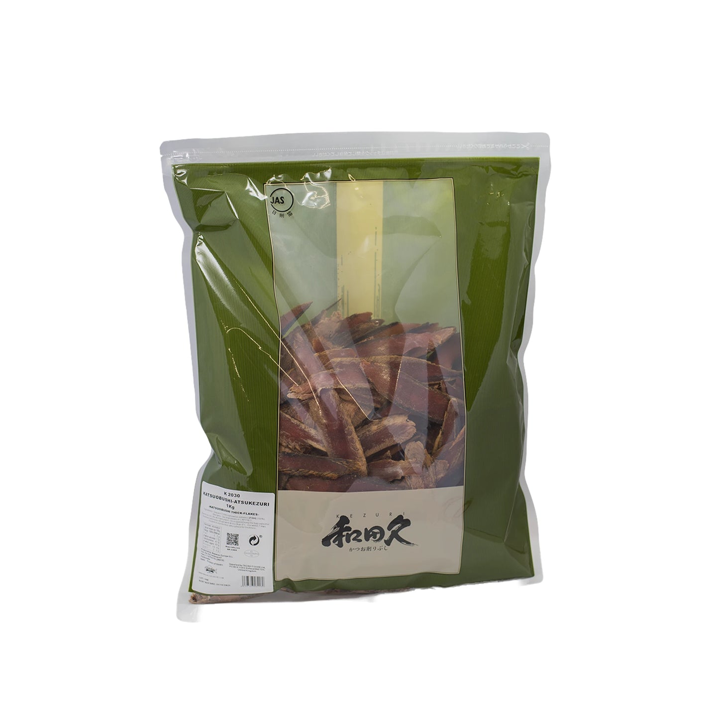 A sealed green plastic bag of Atsukezuri Katsuobushi Bonito Slices (1kg), featuring umami-rich dried fish strips visible through a transparent window and Japanese text on the front label.