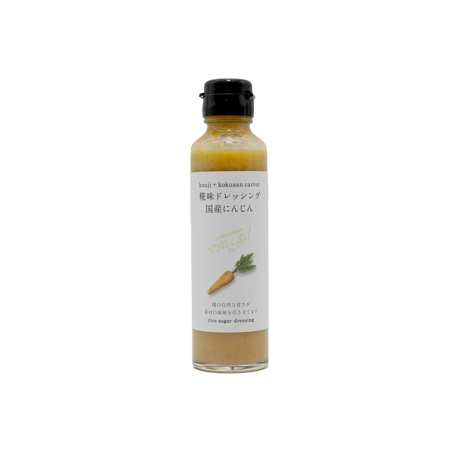 The Carrot and Rice Koji Dressing comes in a clear glass bottle with a black cap; its white label features a carrot illustration and Japanese text, highlighting the rich umami flavor of koji rice.