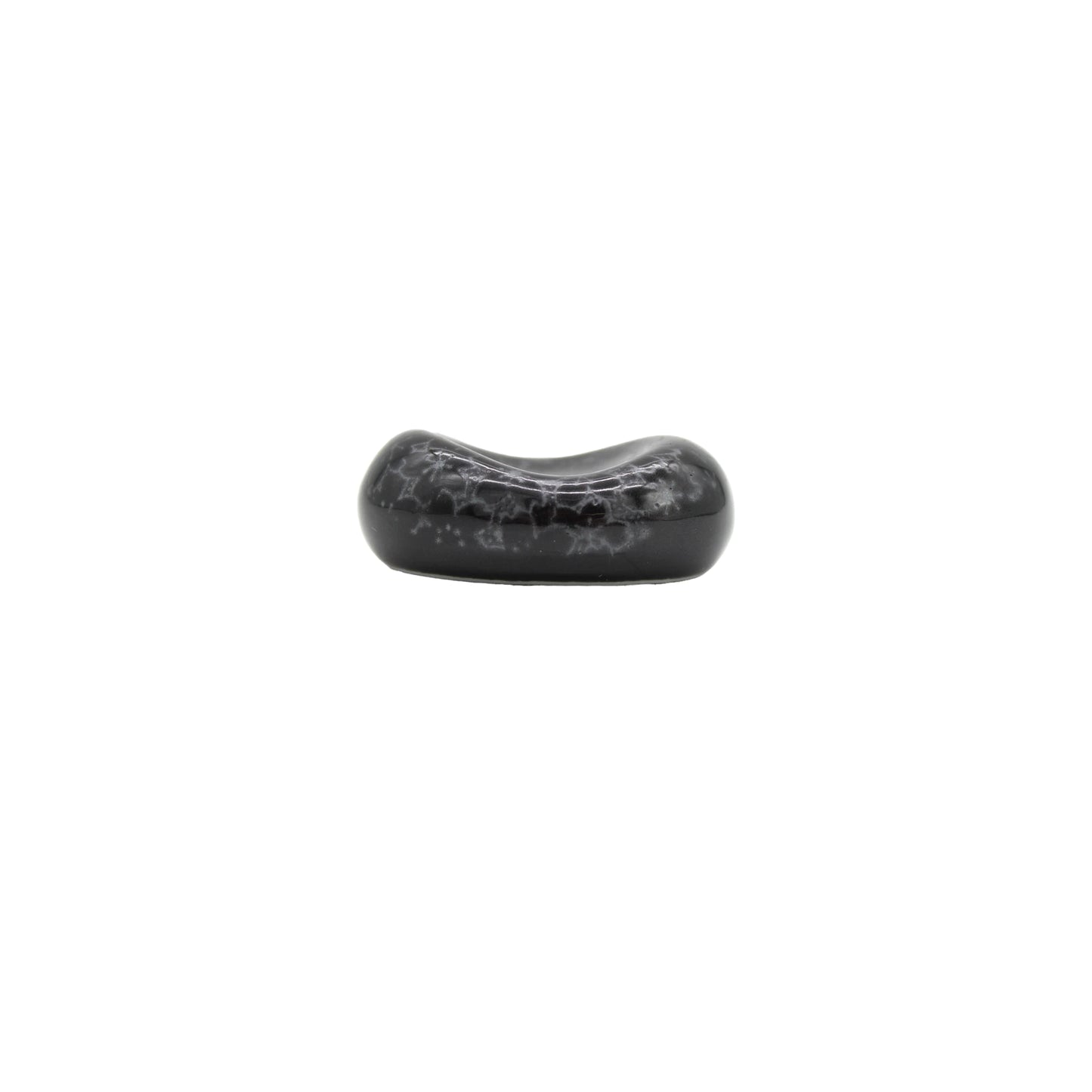 A single Chopstick Rest - Pebble Black Sakura, featuring a glossy black oval with subtle white marbling on a plain background, evokes the sakura designs often seen in Minoyaki porcelain.