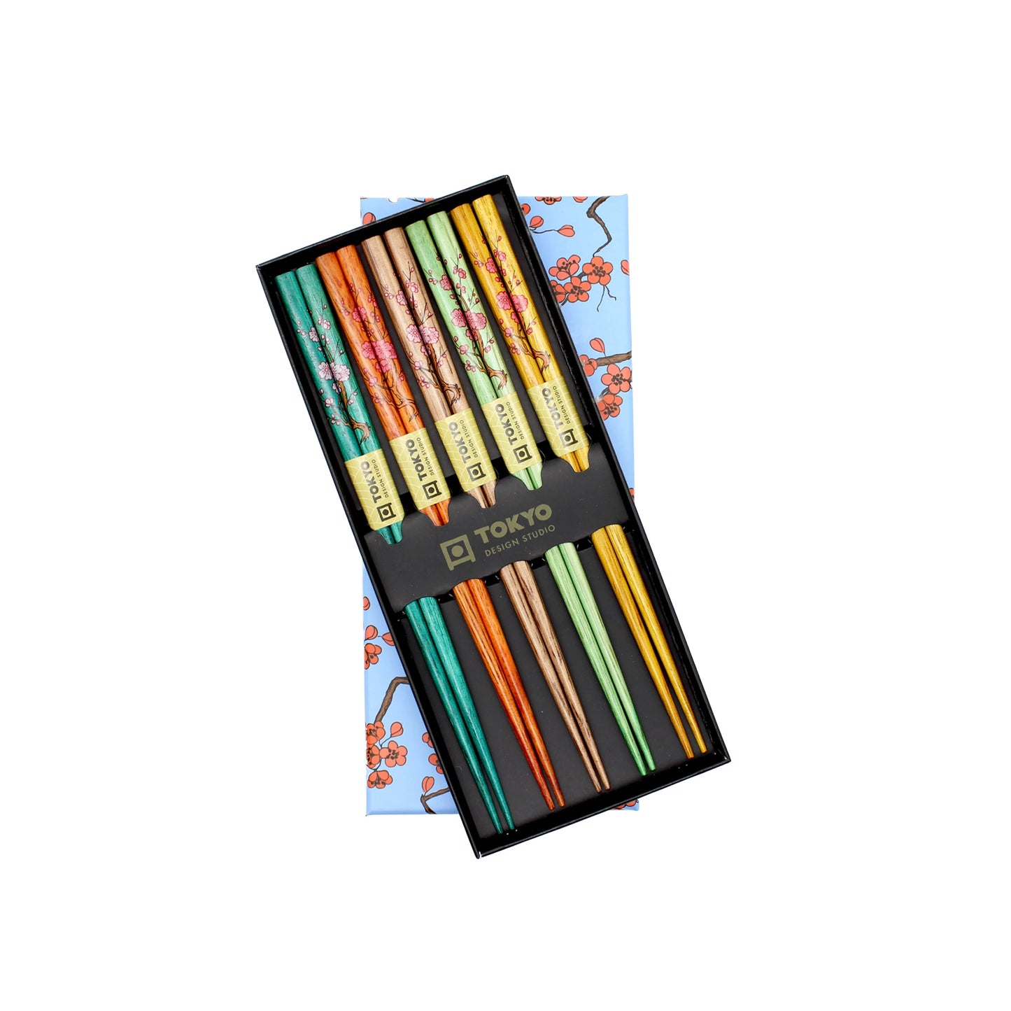 The Chopstick Set - Sakura Design (Pack of 5) is displayed on a blue cloth with a red floral design.