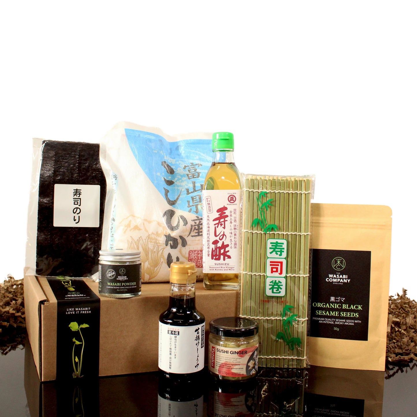 The DIY Sushi Starter Set includes rice, nori, soy sauce, rice vinegar, a bamboo mat, sesame seeds, wasabi, sushi ginger, and a box—perfect for making vegan sushi or taking Japanese cooking classes at home.
