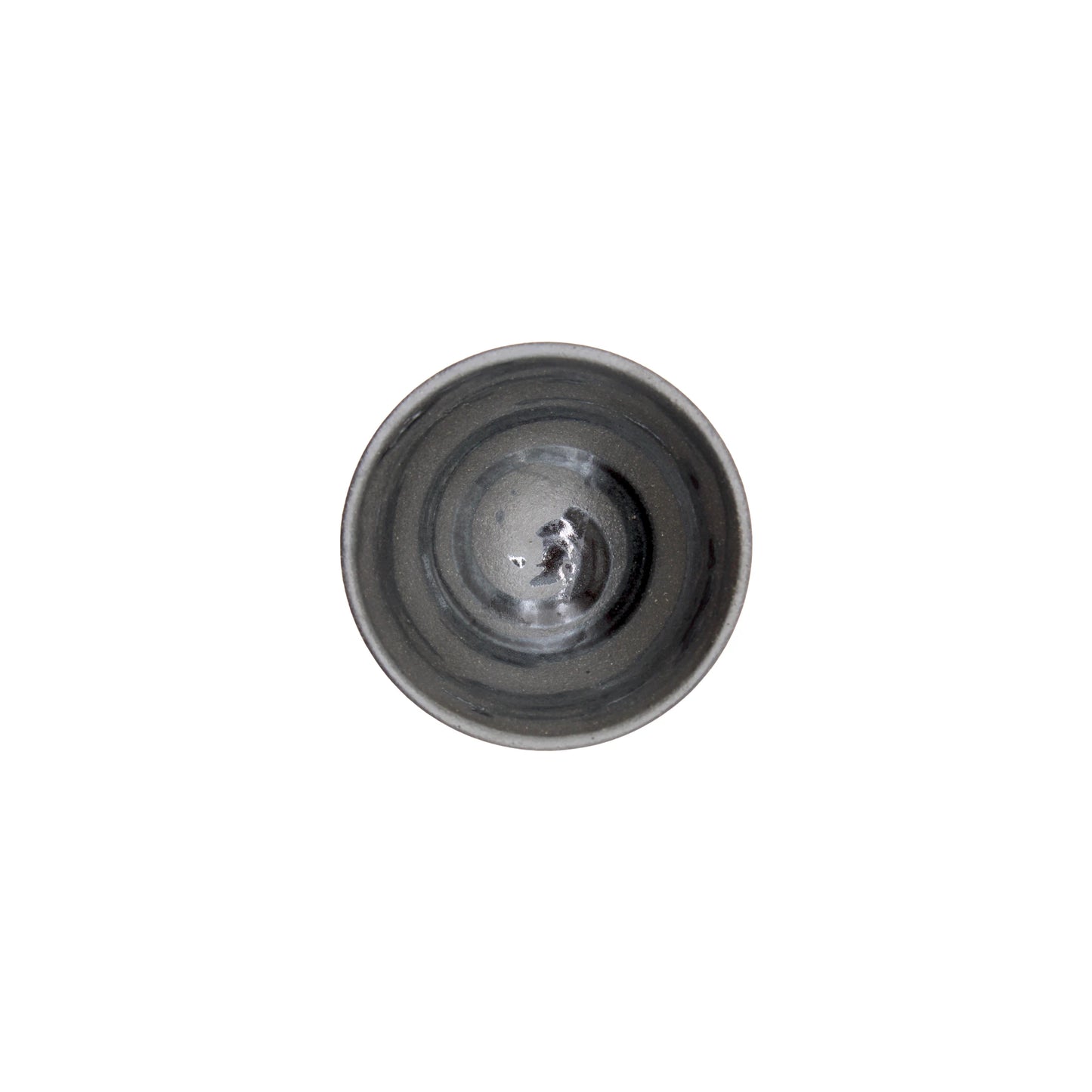 A top view of the Sake Cup - Flat Sakazuki in Black Iga Vortex, a small round ceramic cup with concentric circular patterns and a subtle vortex design, shown on a plain white background.