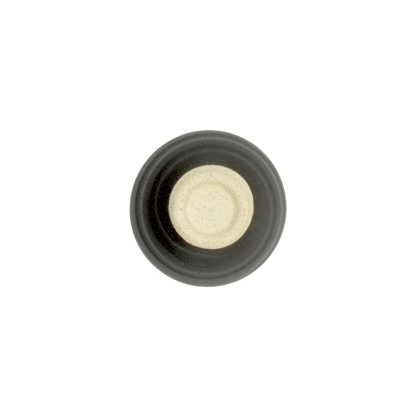 A round, ceramic Sake Cup - Flat Sakazuki in Black Iga Vortex, featuring a beige center and dark grey outer rim in the Iga ware style, viewed from above against a white background.