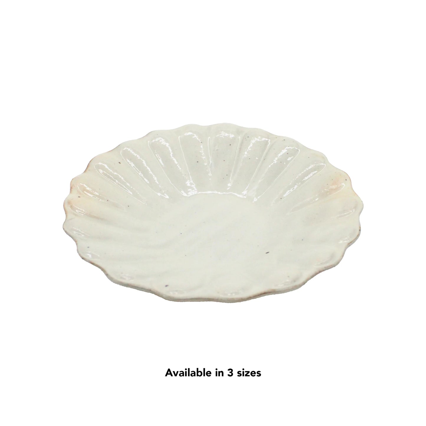 A white, scalloped ceramic plate from the Flower Plates - Iron Scatter collection is displayed on a white background. Text below reads, Available in 3 sizes.
