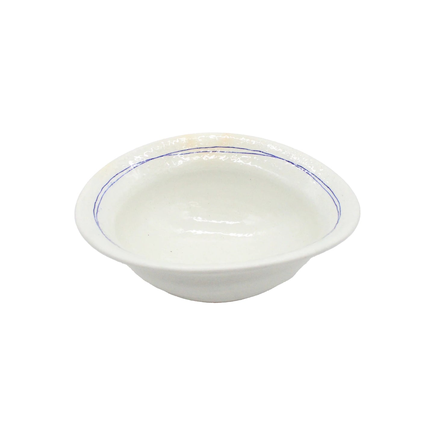 The Serving Bowl - Gothic Line Warped is a shallow white ceramic bowl featuring a simple blue rim, inspired by Japanese ceramic tradition, and displayed against a plain white background.