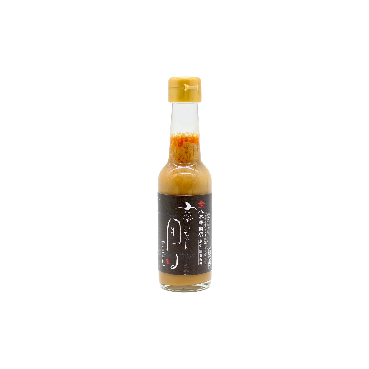 A small glass bottle with a yellow cap holds Gomadare Sesame & Dashi Sauce, featuring a black label with Japanese text and red accents—a classic umami-rich staple in Japanese cuisine.