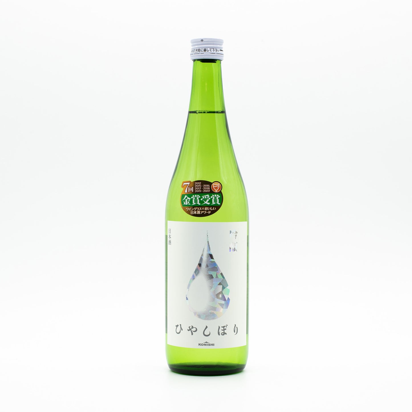 A green glass bottle of Konishi Silver - Ginjo sake with a white label displaying a prominent illustrated droplet and Japanese text, shown on a plain white background.