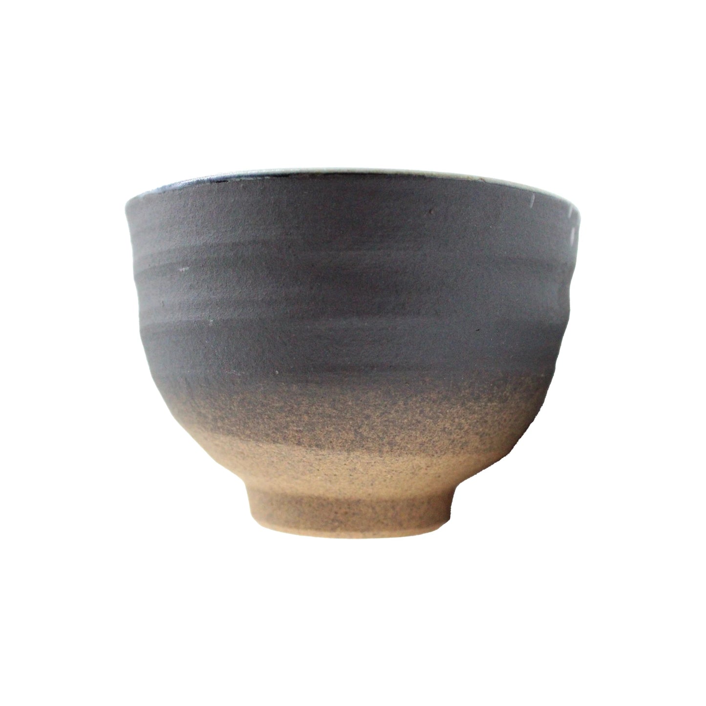 The Tea Cup - Minoyaki Nuribun features a matte dark gray upper half, natural brown lower half, slightly flared rim, and small base—an ideal distinctive ceramic bowl for tea or serving.