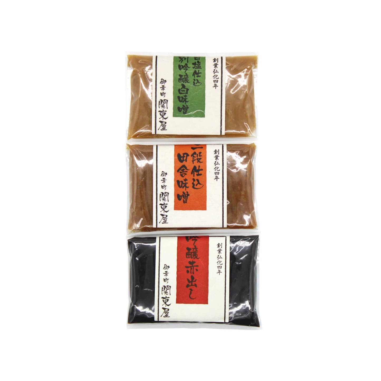 The Kantoya Miso Paste Collection features three vacuum-sealed packs of miso paste—shiro white miso included—with green, brown, and red Japanese-labeled packaging arranged vertically on a white background.