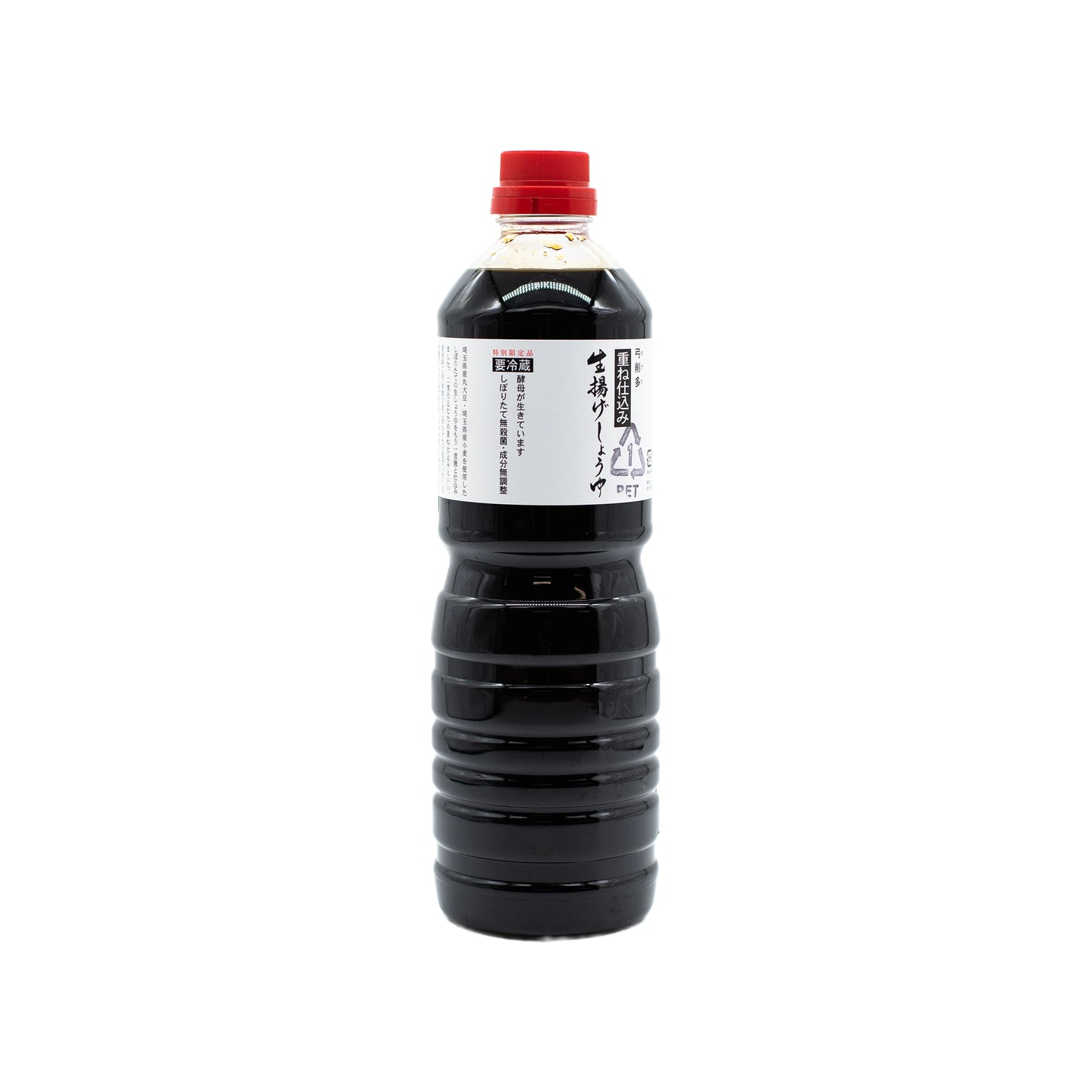 A plastic bottle of Nama Shoyu, Fresh Double Fermented Soy Sauce, with a red cap and white label featuring Japanese text, shown on a plain white background, is renowned for its complex flavour.