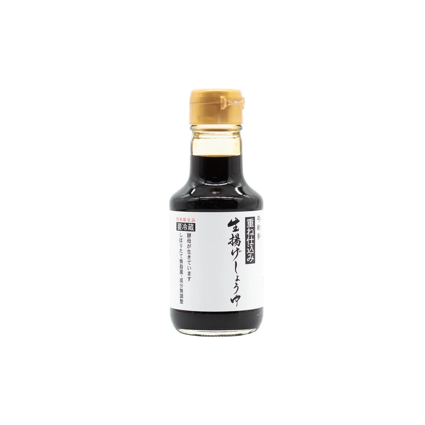 A small glass bottle of Nama Shoyu, Fresh Double Fermented Soy Sauce, with a beige cap and white Japanese label, renowned for its complex flavor, is shown against a plain white background.
