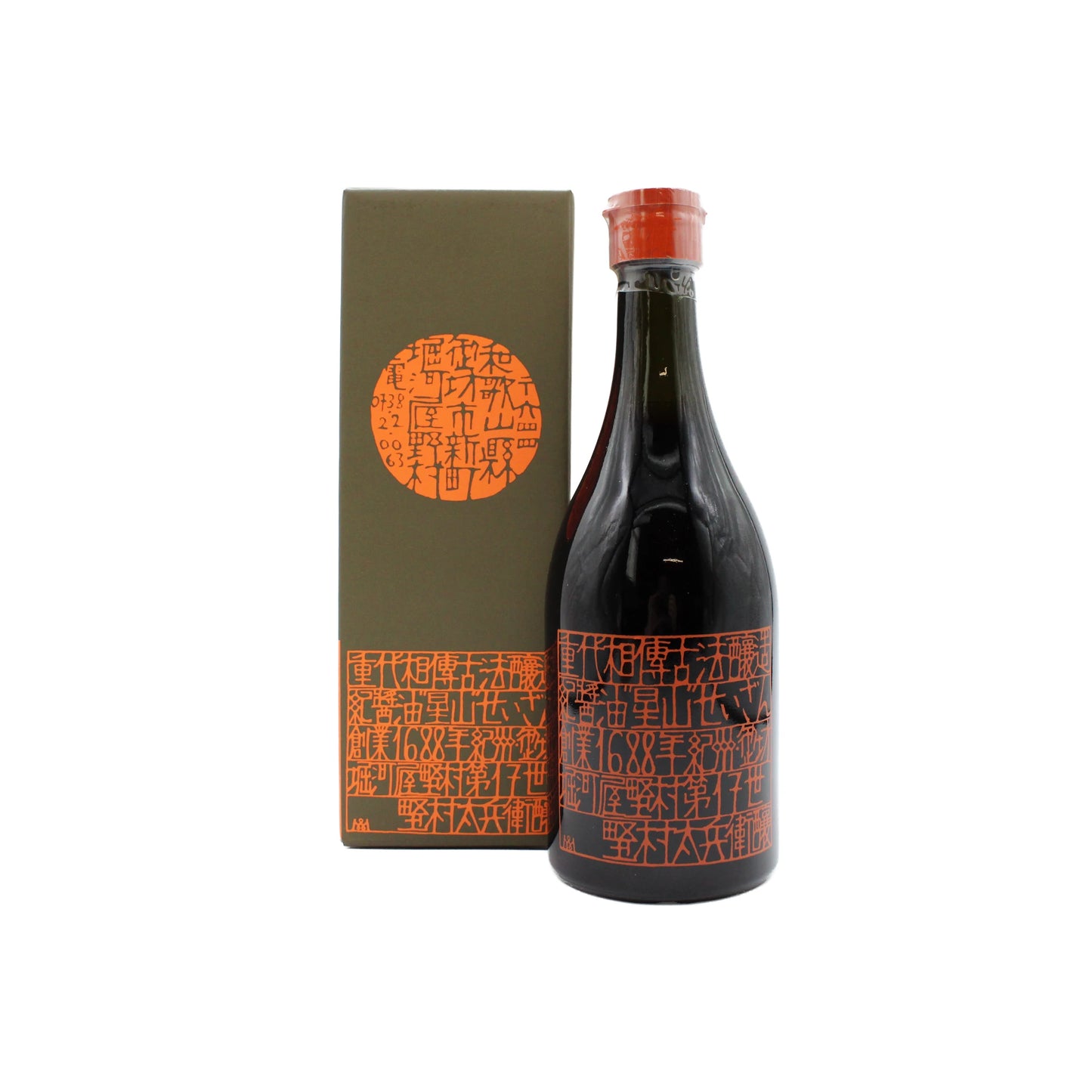 A 500ml dark glass bottle of Premium Mitsuboshi Soy Sauce, adorned with red-orange kanji and a red cap, stands next to an olive-green box featuring matching kanji and a circular motif.
