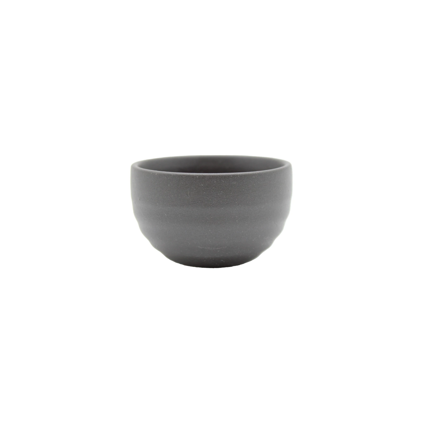 The Sake Cup - Black Bizen, a small, round, matte gray ceramic bowl inspired by Japanese Black Bizen pottery, is centered on a white background.
