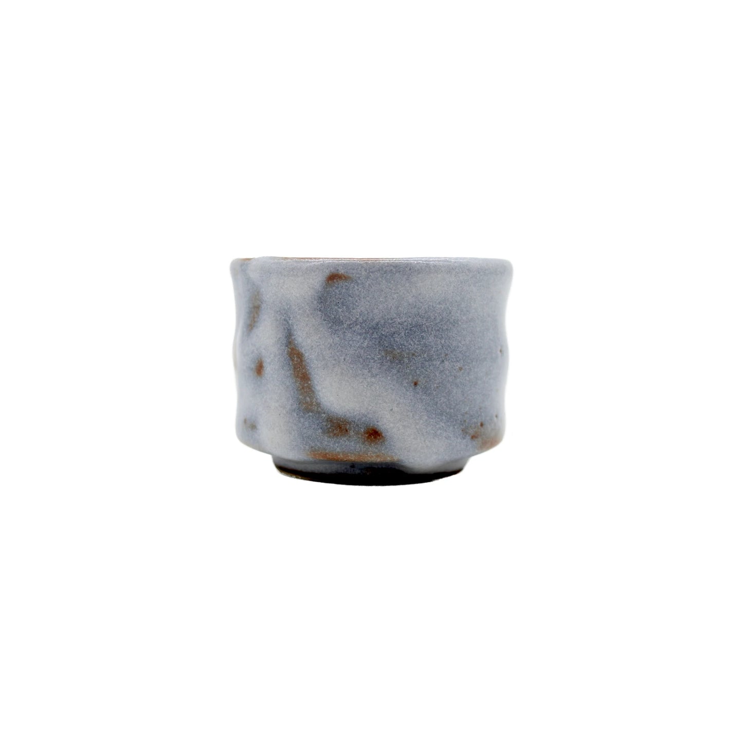 The Sake Cup - White Cloud features a textured, uneven ceramic surface with a greyish-white glaze and brown speckles, highlighting Japanese Minoyaki craftsmanship. Displayed against a plain white background.