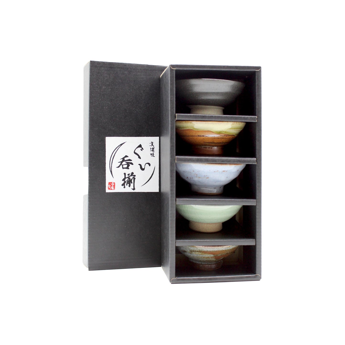 A black box, partially open, reveals the Sakazuki Flat Sake Cups - Set of 5: traditional Japanese sake cups in assorted colors, each neatly stacked in its own compartment for elegant presentation.
