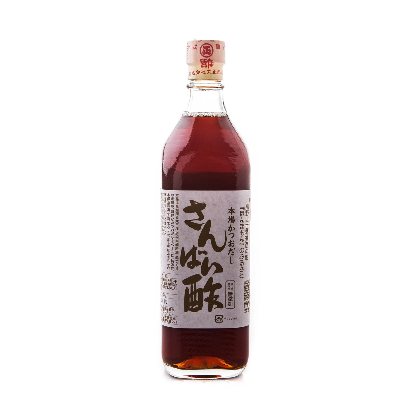 A bottle of Sanbaizu, Bonito Rice Vinegar, with a red cap and beige label with Japanese text, filled with dark brown liquid famous for its rich umami flavor.