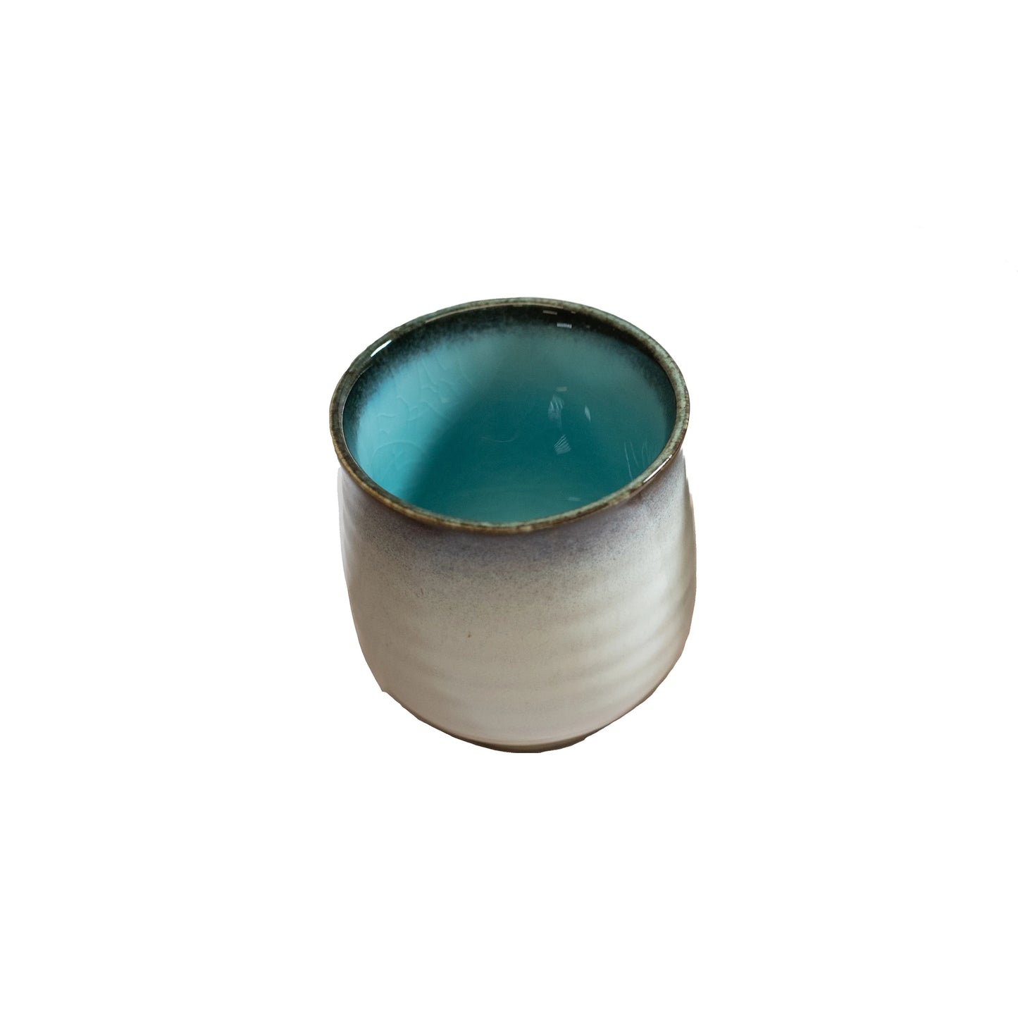The Tea Mug - Sky Blue is a small Minoyaki porcelain cup with a grayish-white exterior and glossy light blue interior, photographed on a white background in traditional Japanese style.