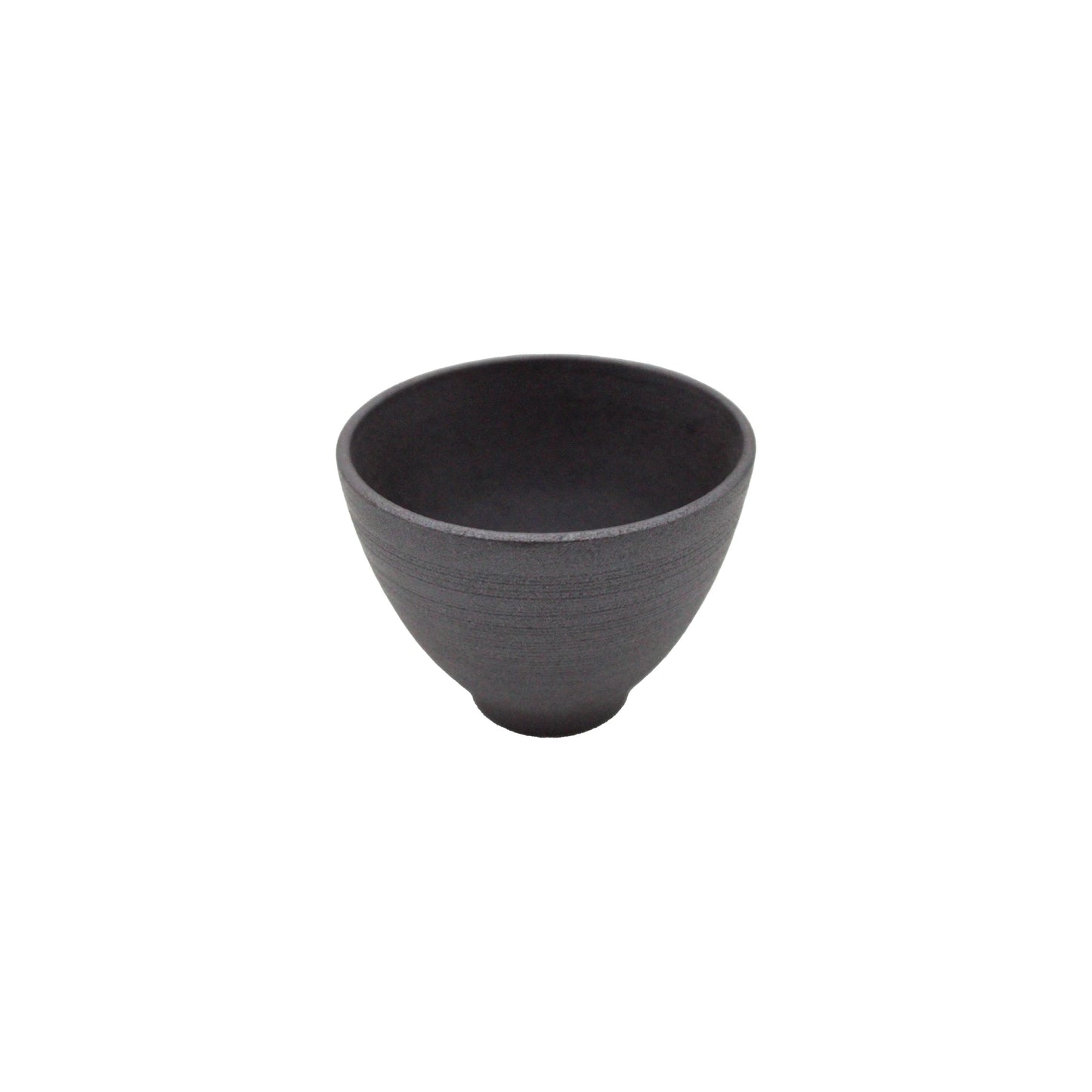 The Tea Cup - Hasamiyaki Kurosendan Black is a small, matte black teacup with a rounded shape and flared rim, showcasing the refined aesthetics of Japanese ceramic art against a white background.