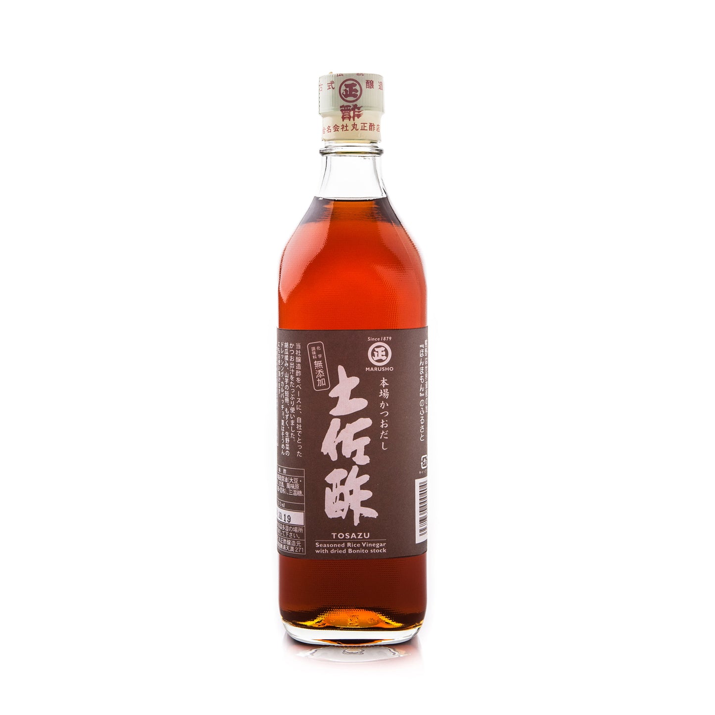 A clear glass bottle containing dark brown Tosazu, Dashi Vinegar stands on a white background with a brown label featuring Japanese text, emphasizing its blend of rice vinegar and savory dashi flavors.