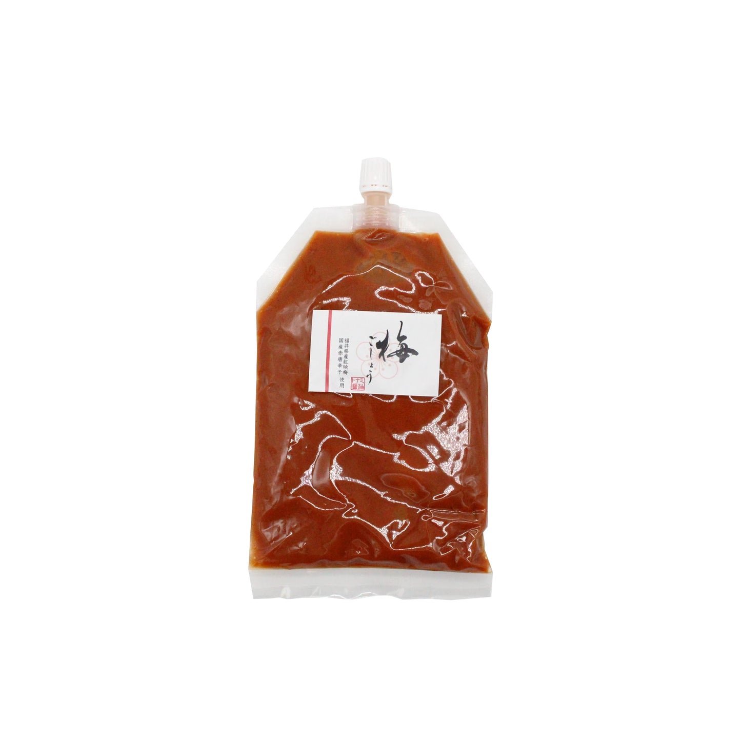 Ume Kosho – Ume Plum & Chilli Paste 300g comes in a clear pouch with a white cap and label, filled with vibrant red paste. This Japanese condiment blends fermented Ume plums and chilli for a uniquely tangy, spicy flavor.