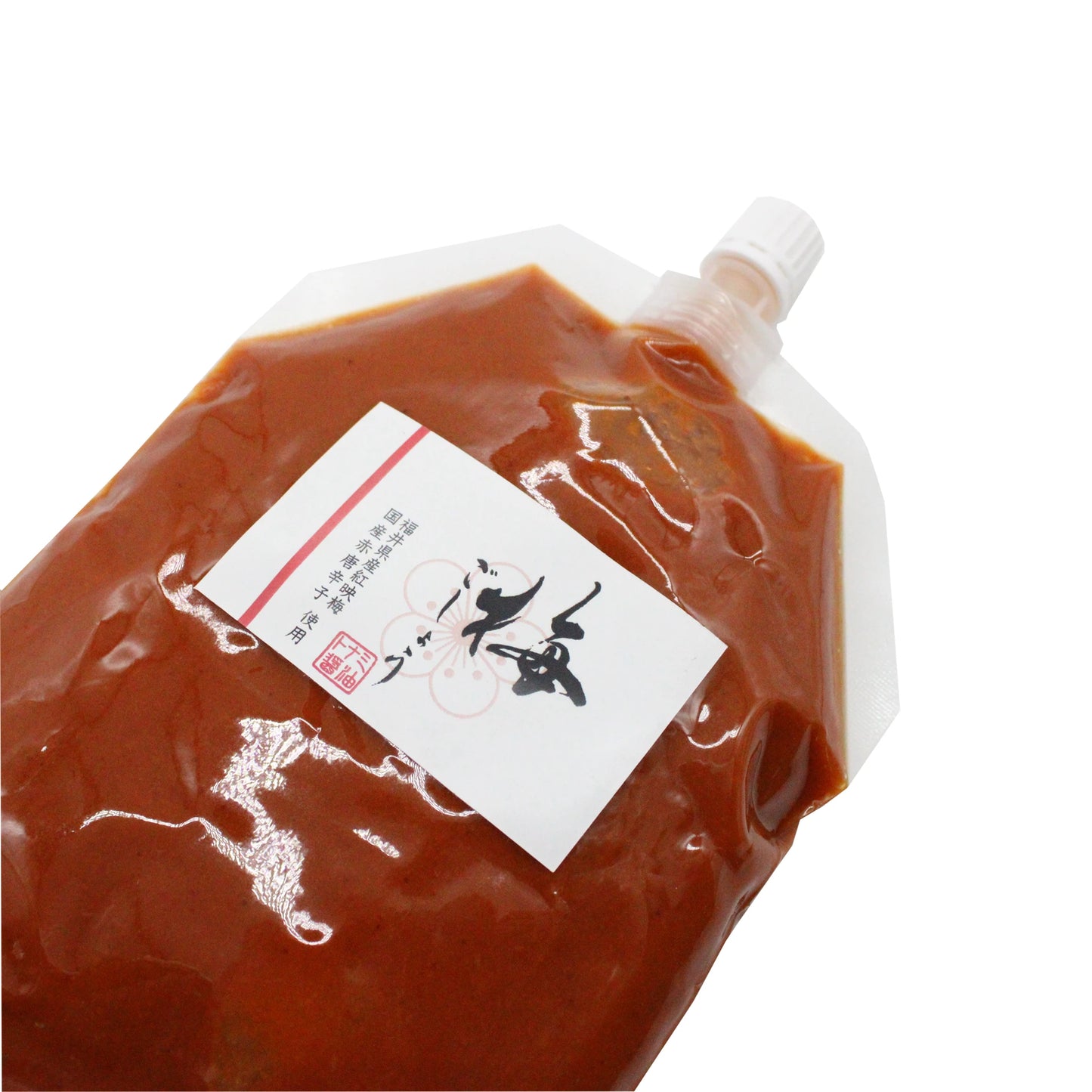 A clear plastic pouch with a white screw cap, labeled in Japanese, contains Ume Kosho – Ume Plum & Chilli Paste 300g—a unique Japanese condiment made from fermented ume plums and chili.