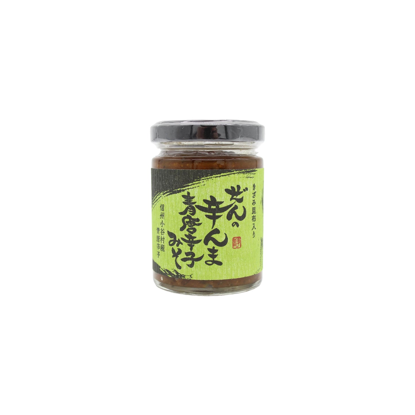 A 120g glass jar of Vegan Zen no Karanma Condiment with a black lid and green Japanese label featuring text and a red stamp. Centered on white, it suggests rich umami flavor from its green pepper miso-inspired contents.