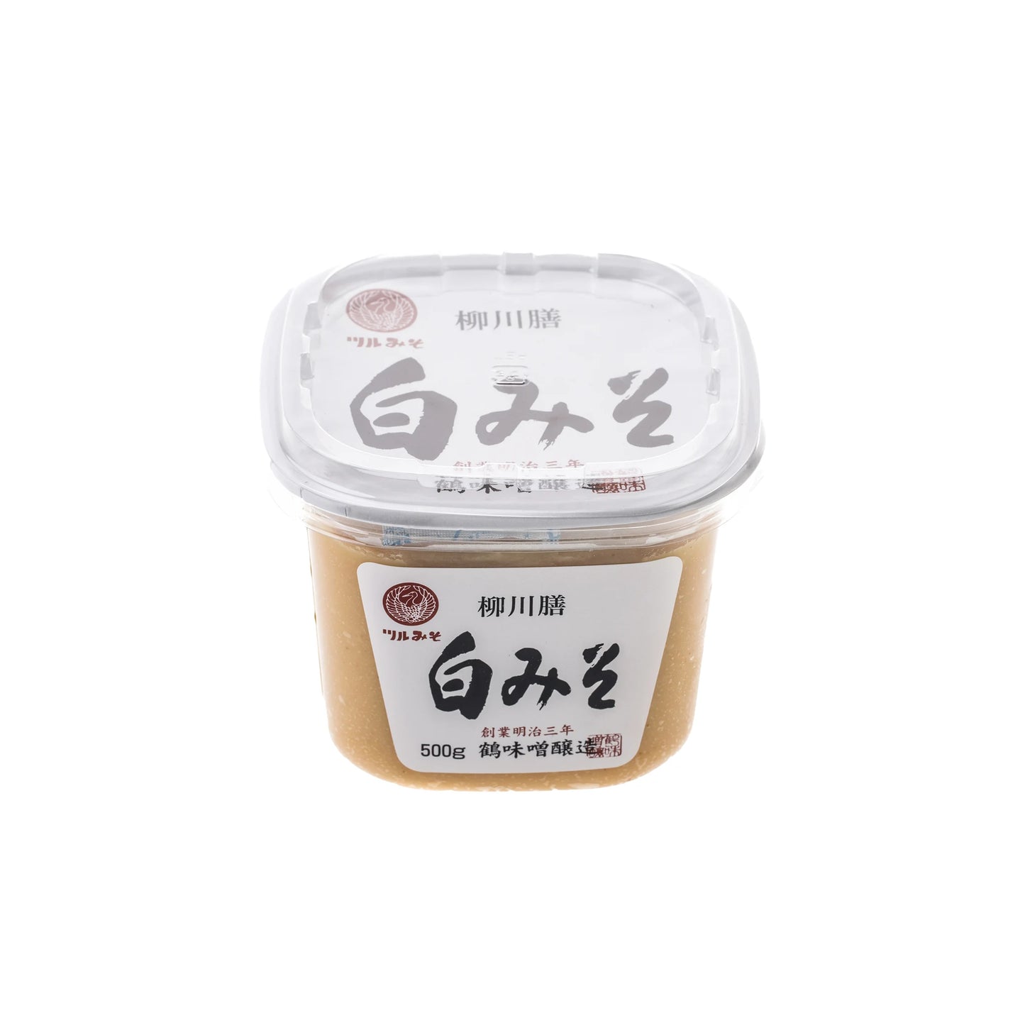 White Miso - 500g: A Japanese miso paste in a clear-lidded container with Japanese text. Ideal for miso soup or recipes needing delicate umami flavor.