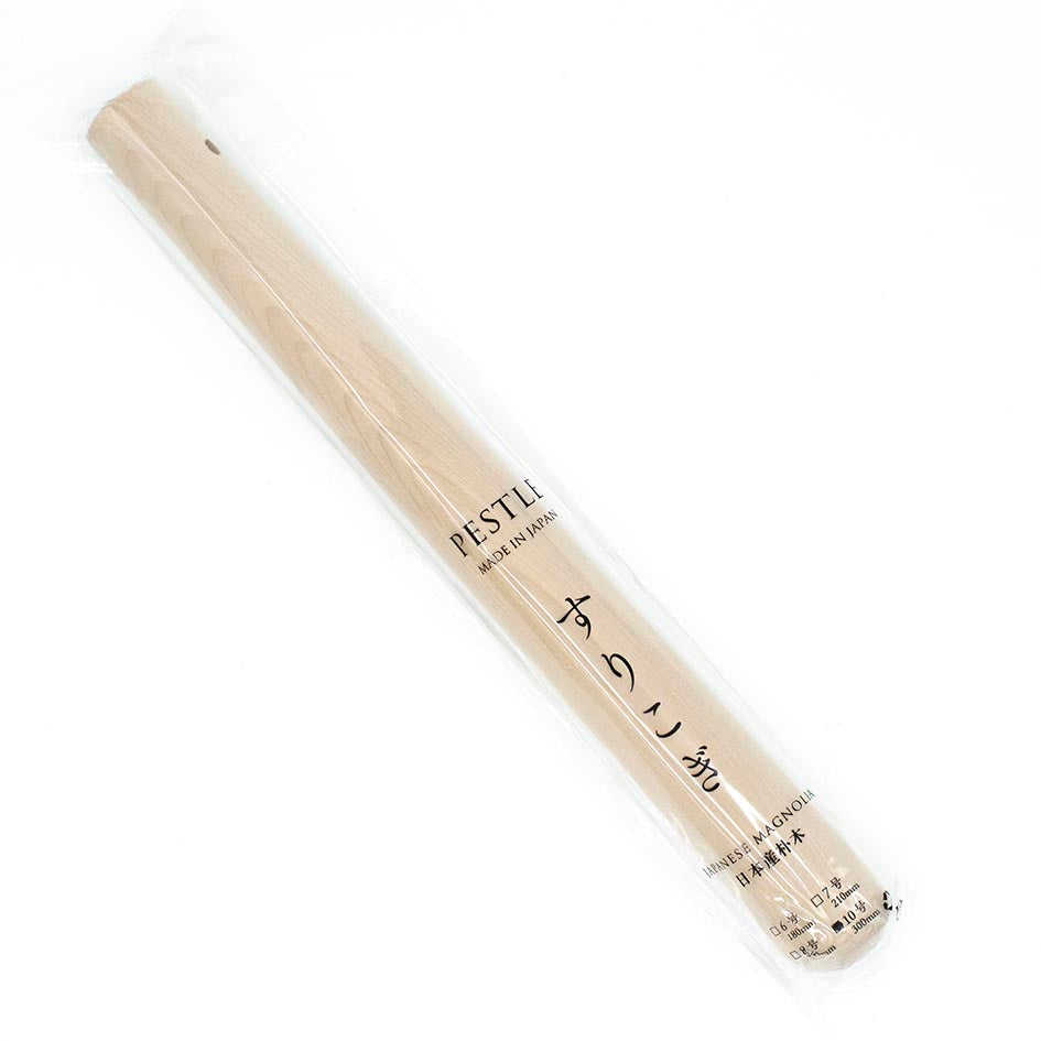 The Suribachi Motoshige, Pestle & Mortar - White, comes in clear plastic packaging with Japanese text; its an essential tool for grinding sesame seeds in earthenware mortar—a must-have for authentic Japanese cooking.