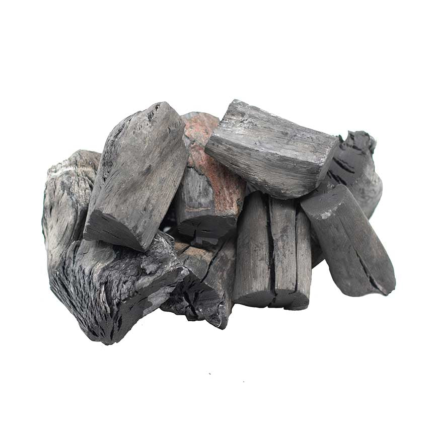 A pile of irregularly shaped Binchotan Charcoal Ikkyu from Japan - 1kg pieces stacked together on a white background.