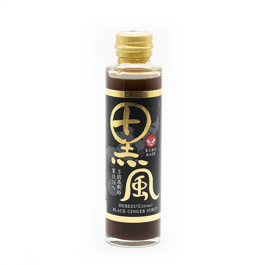 A clear glass bottle with a gold cap, labeled Black Ginger Syrup - 180ml in English and Japanese, contains dark brown ginger syrup valued for its health benefits.