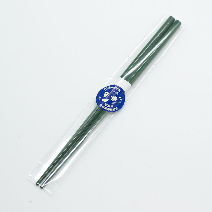 A pair of Chopsticks - Deep Green in a clear plastic wrapper with a blue dishwasher safe sticker and Chinese text, made by Zumi workshop.