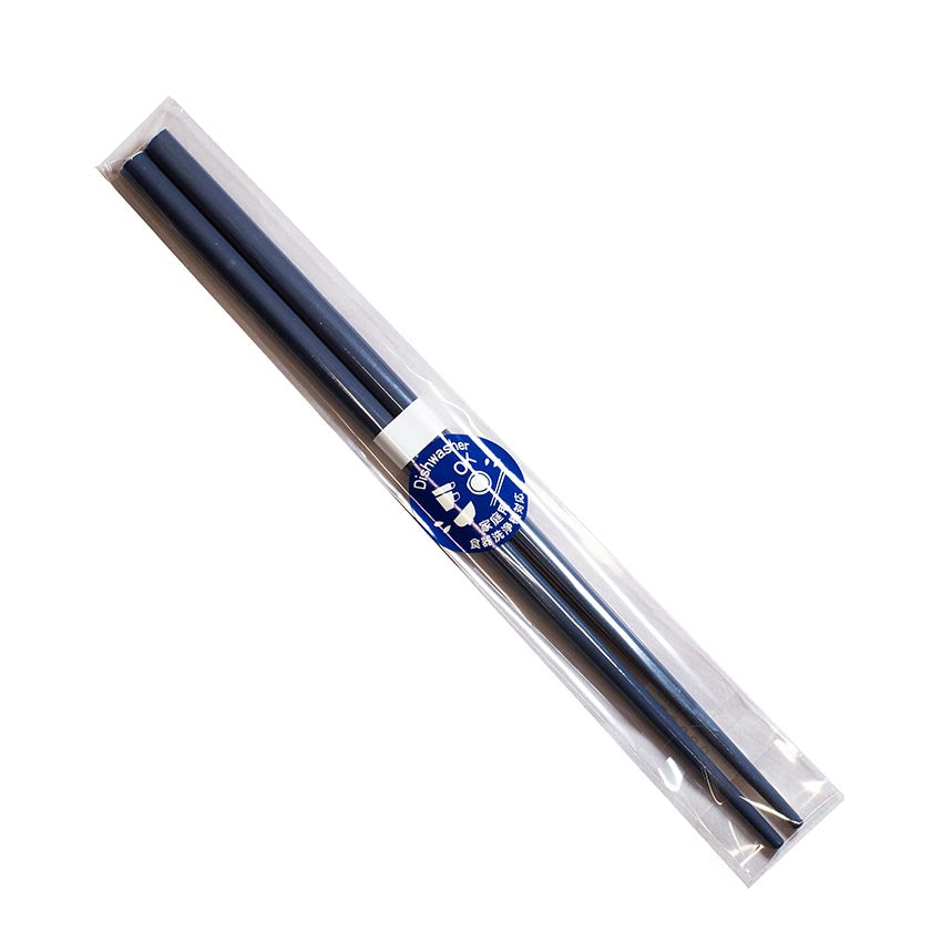A pair of Chopsticks - Navy Blue, presented in a clear plastic sleeve with a blue and white label, crafted by Zumi workshop, renowned for exquisite lacquerware designs.