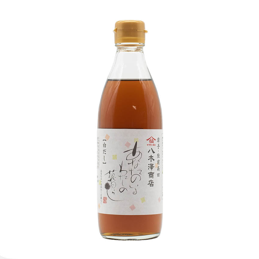 A clear bottle with a tan plastic cap holds Concentrated Dashi Stock (360ml), a brown liquid rich in umami, and features a white label with Japanese text and small decorative elements.