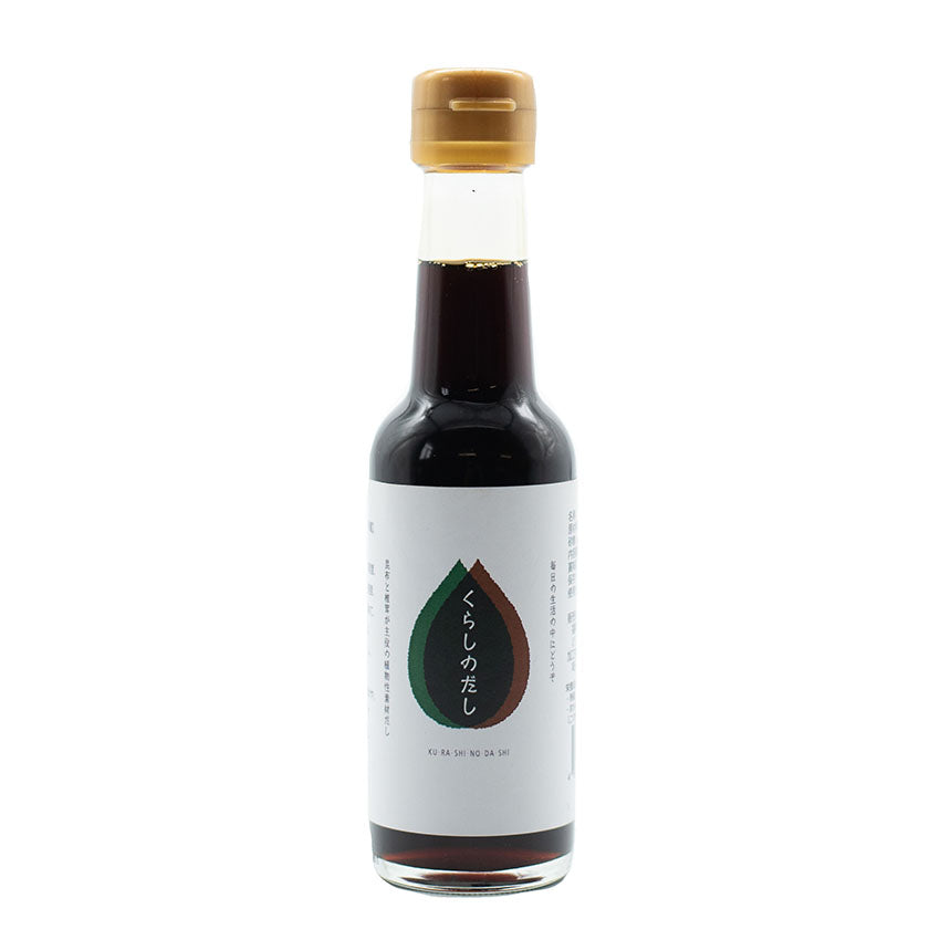 A glass bottle of Concentrated Vegan Dashi with a gold cap and a white label featuring Japanese text and a brown-green teardrop design, ideal for Japanese dishes or enriching dashi broth.