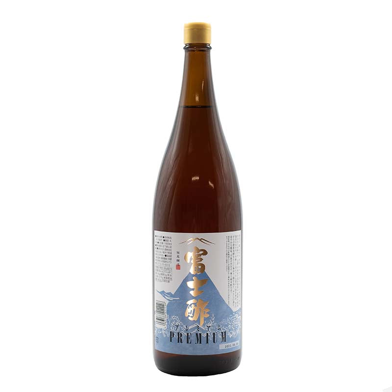 A large brown bottle of Premium Fujisu Rice Vinegar with a blue and white label displaying Japanese characters and a mountain illustration, crafted through traditional fermentation for rich umami flavor.
