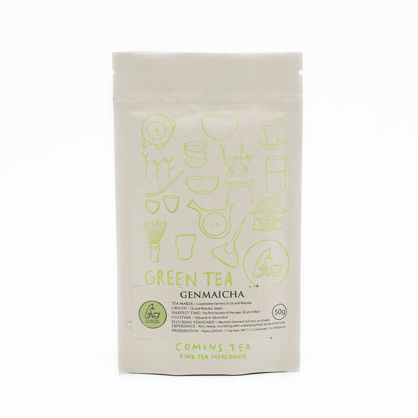 A beige pouch labeled Genmaicha Tea - 50g, with green teaware illustrations, features a blend of sencha and roasted brown rice as detailed on the packaging.