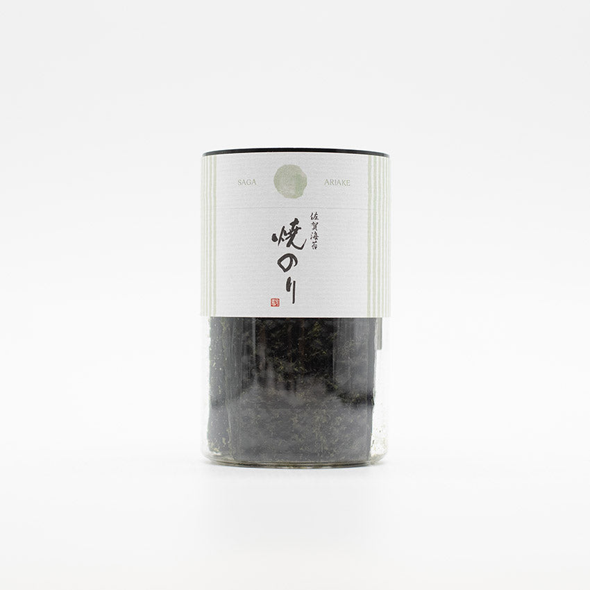 A clear cylindrical container with a white label holds Roasted Nori - 40 mini sheets. The simple Japanese design makes it perfect for sushi or onigiri preparations.