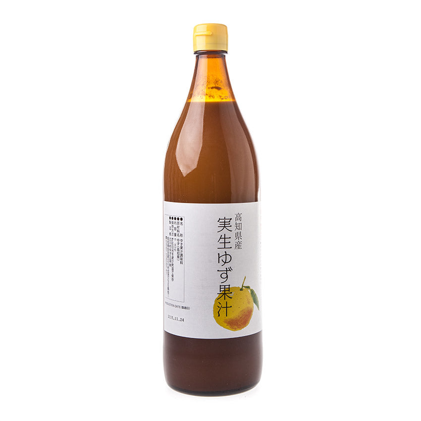 A large brown bottle with a yellow cap and a white label featuring Japanese text and a yuzu image, showcasing Wild Yuzu Juice from Kochi and its distinct citrus flavor.