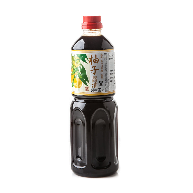 A 1L plastic bottle of Yugeta Yuzu Soy with a red cap, ideal for Japanese dishes, features a label with Japanese text and citrus fruit illustrations.