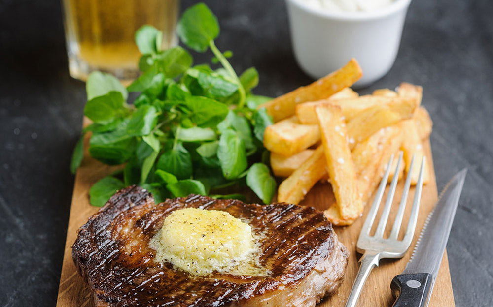 Rib Eye Steak with Wasabi Butter, served with Chips, Wasabi Aioli & Watercress Salad