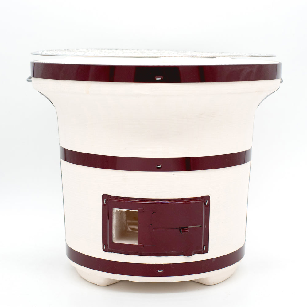 The Shichirin Table Barbecue Set, in white and maroon, includes a metal grate top and a small rectangular front door—perfect for grilling with Binchotan charcoal at your next barbecue.