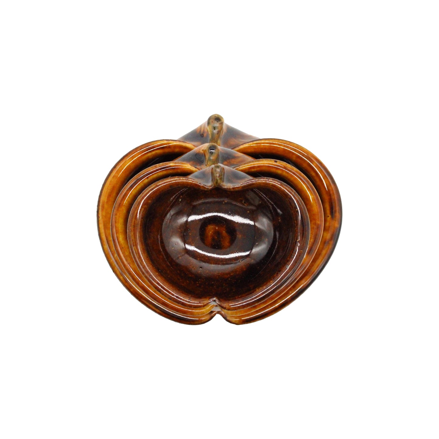 
                  
                    A set of three Apple Bowls - Candy Glaze, featuring a brown ceramic finish and heart-shaped design, elegantly stacked on a white background to highlight the beauty of Japanese pottery.
                  
                