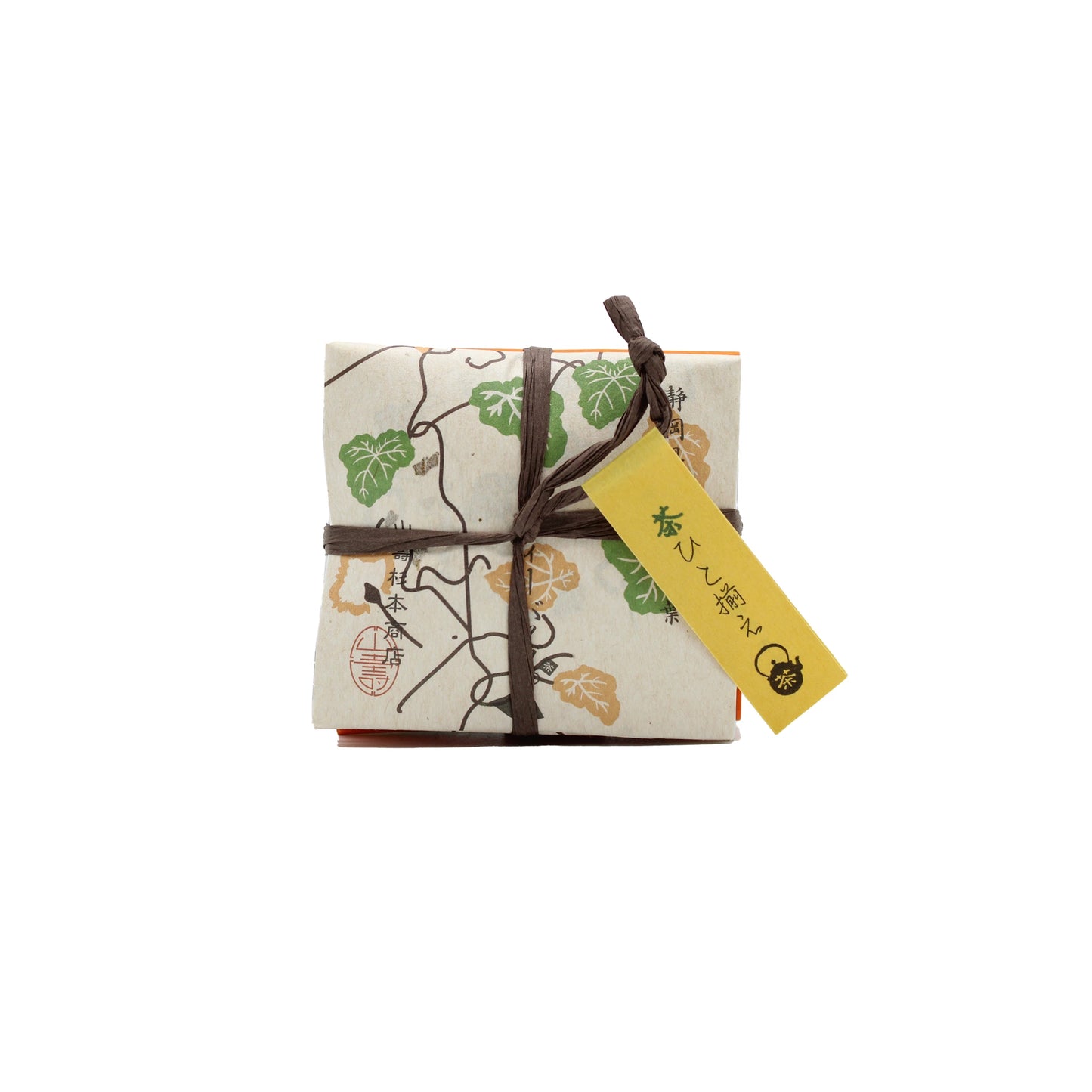 
                  
                    A neatly wrapped package with decorative paper, brown string, and a yellow tag showcases the elegance of Japanese Tea Assortment (8 bags, 4 different teas) gifts, set against a white background.
                  
                