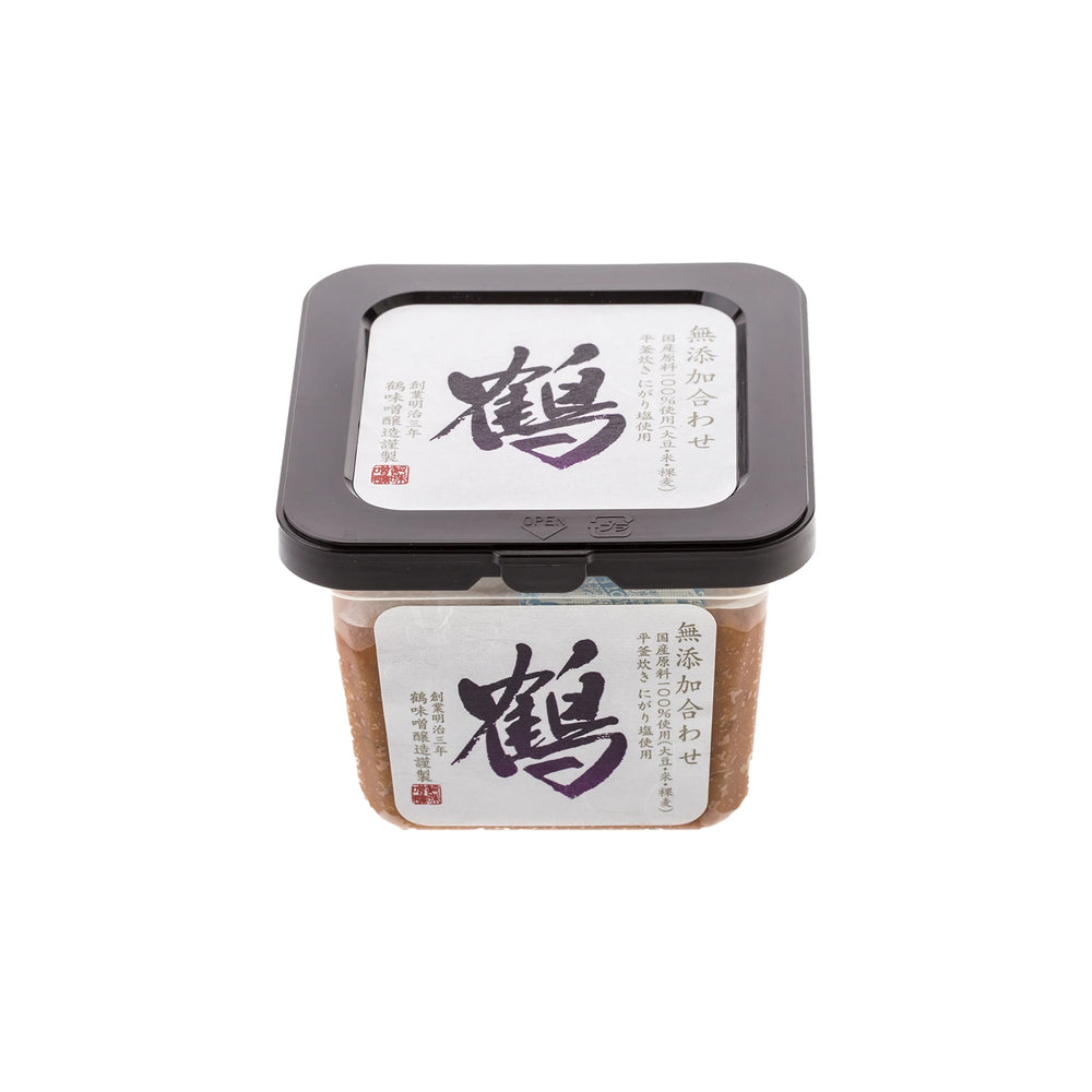 A square plastic container of Awase Barley Miso (500g), celebrated for its umami richness, with white labels featuring black calligraphy and Japanese text.