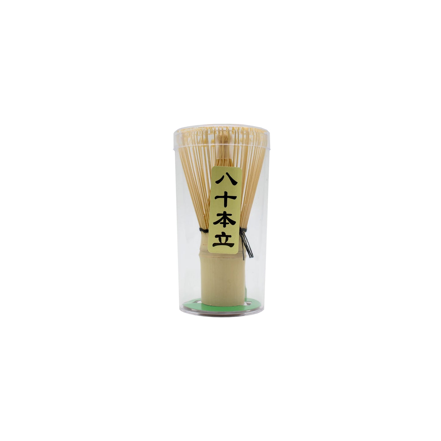 The Bamboo Matcha Green Tea Whisk is a Japanese tea tool, packaged upright in a clear cylindrical container with a yellow label featuring Japanese text—ideal for preparing authentic matcha.