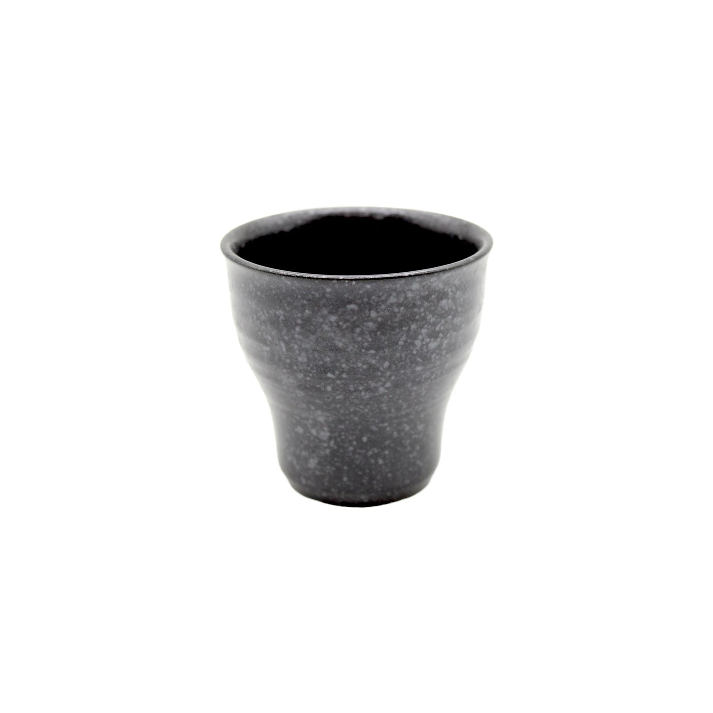 The Tea Cup - Black Fluted is a small, gunmetal black ceramic cup featuring a flared top and rounded base, displayed on a plain white background.